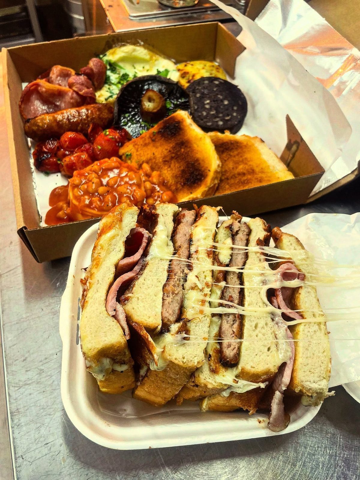 The Breakfast Club Stack: Fresh tiger loaf bathed in egg, griddled with cheese, bacon and sausage