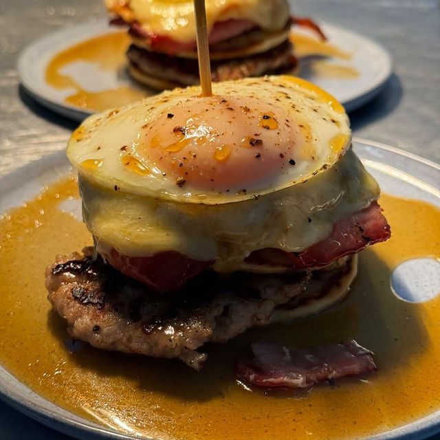 Breakfast Pancake Stack topped with a fried egg